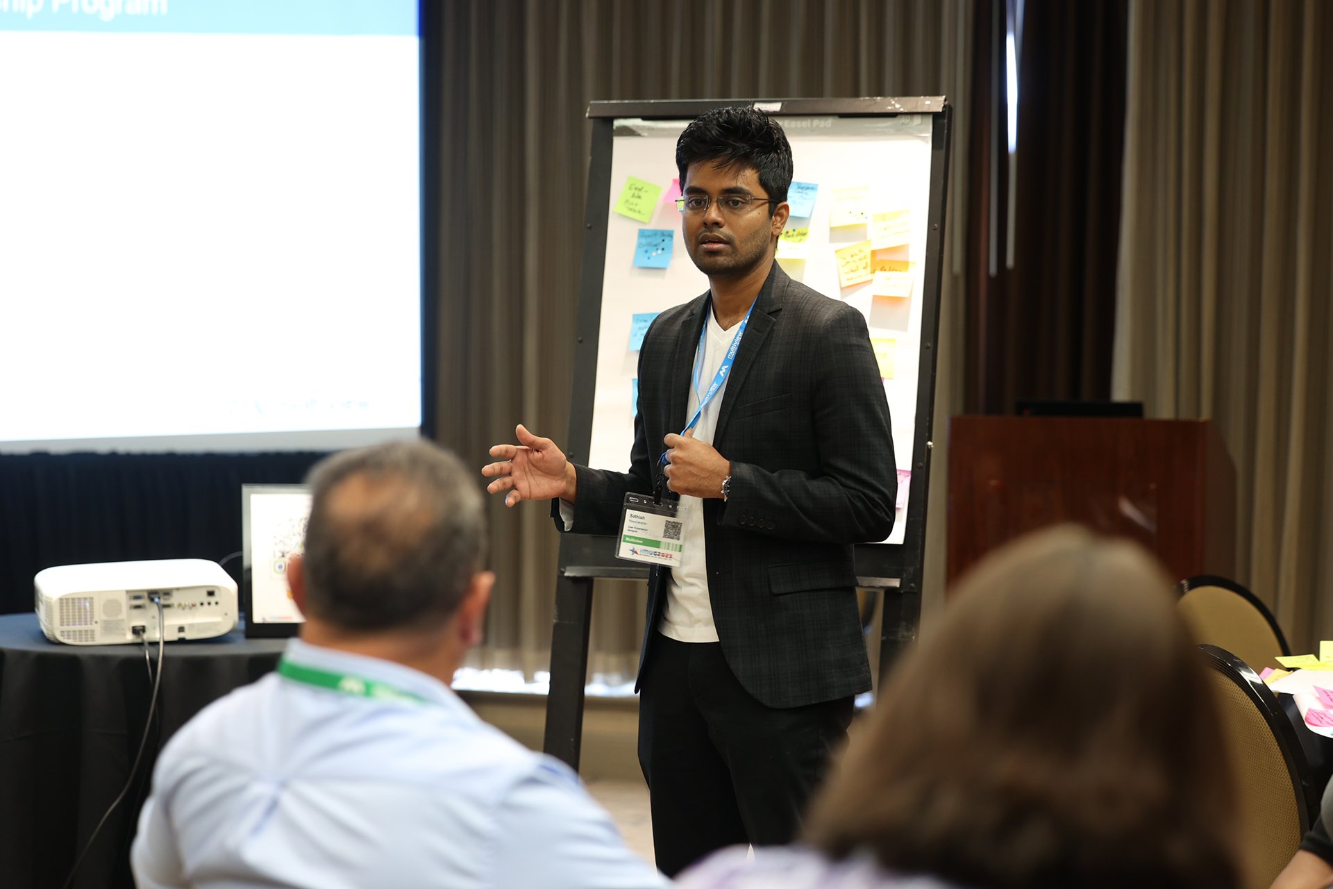UX/UI Designer Sathish speaking during a collaborative design session.