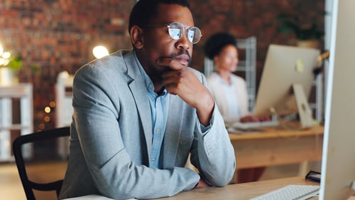 A businessman thinking up ideas in the office.